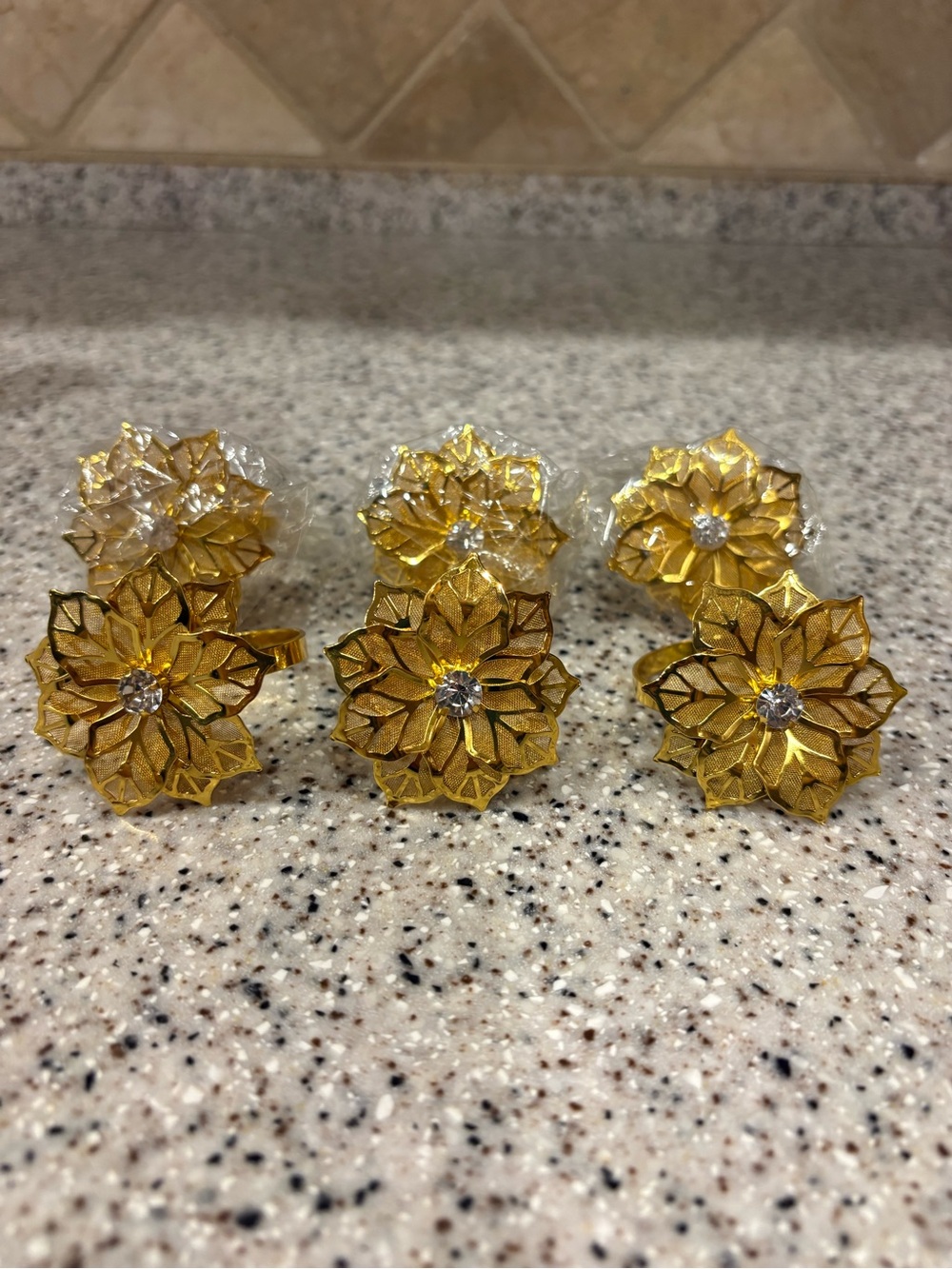 Gold-colored metal mesh flower napkin rings. Set Of 6